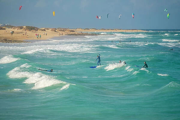 View of surfboarders and the Atlantic Ocean, Corralejo Natural Park, Fuerteventura, Canary Islands, Spain, Atlantic, Europe