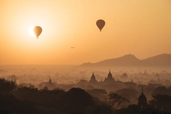 View of temples and hot air balloons at dawn, Bagan (Pagan), Mandalay Region, Myanmar (Burma)