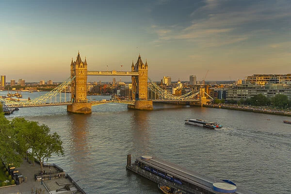 View of Tower Bridge and River Thames from Cheval Three Quays at sunset, London, England