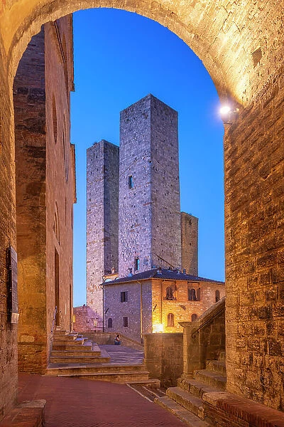 View of towers in Piazza del Duomo at dusk, San Gimignano, UNESCO World Heritage Site, Province of Siena, Tuscany, Italy, Europe