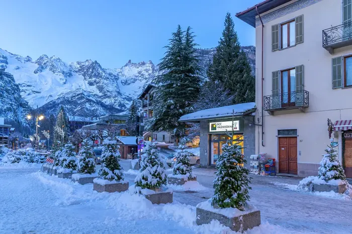 Framed Print : View of town centre and snow covered mountains in background at dusk, Courmayeur, Aosta Valley, Italian Alps, Italy Framed Print : View of town centre and snow covered mountains in background at dusk, Courmayeur, Aosta Valley, Italian Alps, Italy