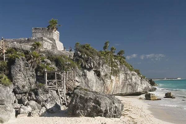 View of Tulum Beach with El Castillo (the Castle) in the Mayan ruins of Tulum in the background