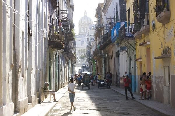 View along a typical residential street in Havana Vieja showing children playing