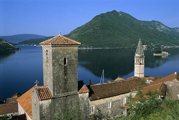 View over village and bay with island of St. George, Perast, The Boka Kotorska (Bay of Kotor), UNESCO World Heritage Site, Montenegro, Europe