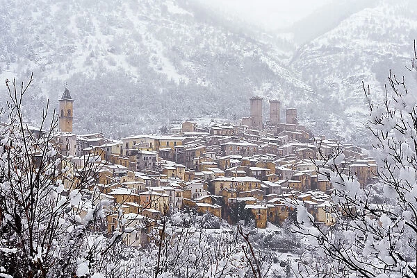 View of the village and the castle of Pacentro under heavy snowfall, Maiella National Park, L'Aquila province, Abruzzo, Italy, Europe
