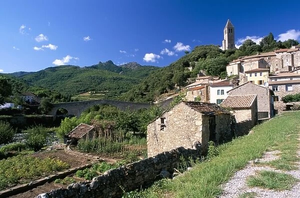 View to village on hillside above the Jaur river, Olargues, Herault, Languedoc-Roussillon