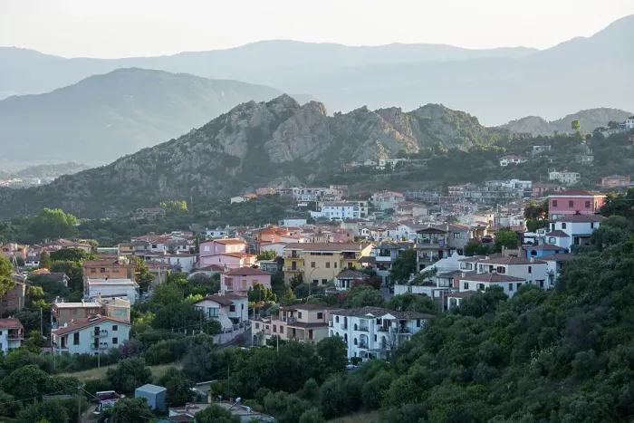Framed Print : View over village rooftops from hilltop viewpoint, sunset, Santa Maria Navarrese, Baunei, Nuoro, Sardinia, Italy, Mediterranean, Europe