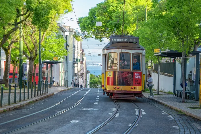 Framed Print : View of vintage tram and colourful buildings in the Alfama District on a sunny day, Lisbon, Portugal, Europe