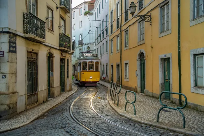 Framed Print : View of vintage tram and colourful buildings in the Alfama District on a sunny day, Lisbon, Portugal, Europe Framed Print : View of vintage tram and colourful buildings in the Alfama District on a sunny day, Lisbon, Portugal, Europe