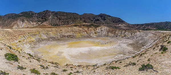 View of visitors exploring the Stefanoskrater Crater, Nisyros, Dodecanese, Greek Islands, Greece, Europe