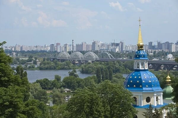 View of Vydubychi Monastery, looking over the Dnipro River to the residential area of Berezniaky, Kiev, Ukraine, Europe