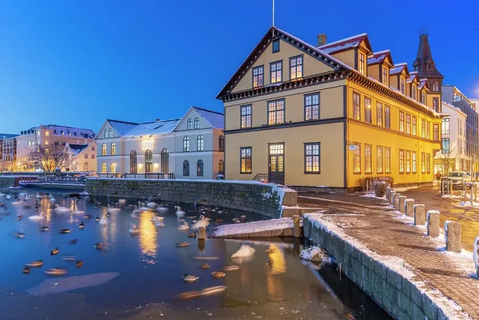 Framed Print : View of waterfront buildings and City Hall in background in the city centre of Reykjavik at dusk in winter, Reykjavik, Iceland Framed Print : View of waterfront buildings and City Hall in background in the city centre of Reykjavik at dusk in winter, Reykjavik, Iceland