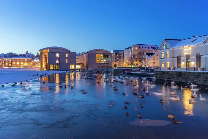 Framed Print : View of waterfront buildings and City Hall in background in the city centre of Reykjavik at dusk in winter, Reykjavik, Iceland Framed Print : View of waterfront buildings and City Hall in background in the city centre of Reykjavik at dusk in winter, Reykjavik, Iceland