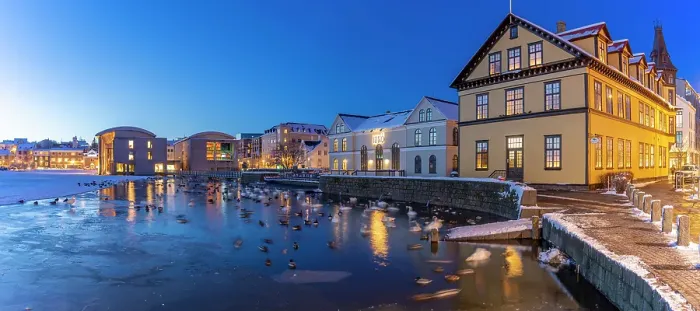 Framed Print : View of waterfront buildings and City Hall in background in the city centre of Reykjavik at dusk in winter, Reykjavik, Iceland Framed Print : View of waterfront buildings and City Hall in background in the city centre of Reykjavik at dusk in winter, Reykjavik, Iceland