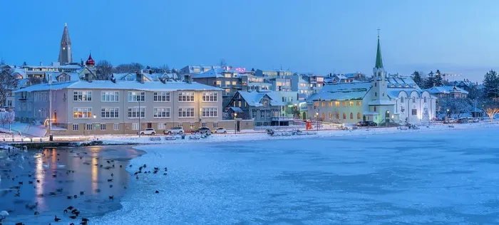 Framed Print : View of waterfront buildings and city skyline in background in the city centre of Reykjavik at dusk in winter, Reykjavik, Iceland Framed Print : View of waterfront buildings and city skyline in background in the city centre of Reykjavik at dusk in winter, Reykjavik, Iceland