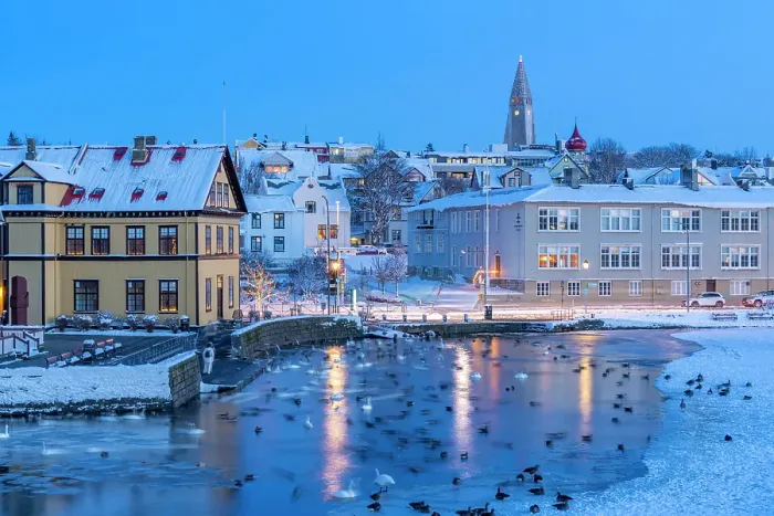 Framed Print : View of waterfront buildings and city skyline in background in the city centre of Reykjavik at dusk in winter, Reykjavik, Iceland Framed Print : View of waterfront buildings and city skyline in background in the city centre of Reykjavik at dusk in winter, Reykjavik, Iceland