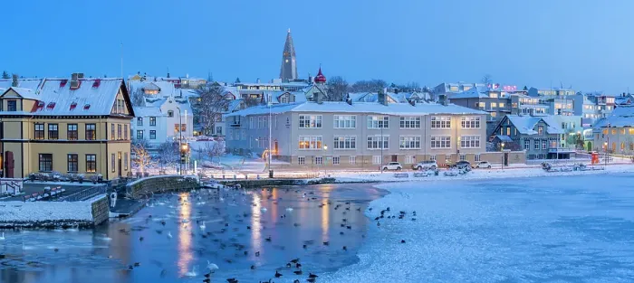 Framed Print : View of waterfront buildings and city skyline in background in the city centre of Reykjavik at dusk in winter, Reykjavik, Iceland Framed Print : View of waterfront buildings and city skyline in background in the city centre of Reykjavik at dusk in winter, Reykjavik, Iceland