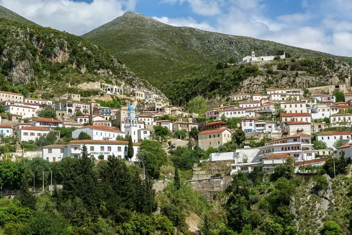 Framed Print : View of whitewashed buildings on mountainside, village of Dhermi, Albania, Europe Framed Print : View of whitewashed buildings on mountainside, village of Dhermi, Albania, Europe