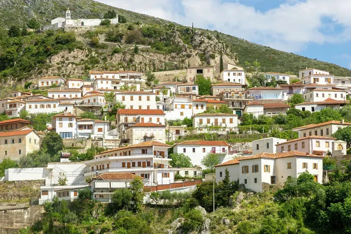 Framed Print : View of whitewashed buildings on mountainside, village of Dhermi, Albania, Europe Framed Print : View of whitewashed buildings on mountainside, village of Dhermi, Albania, Europe