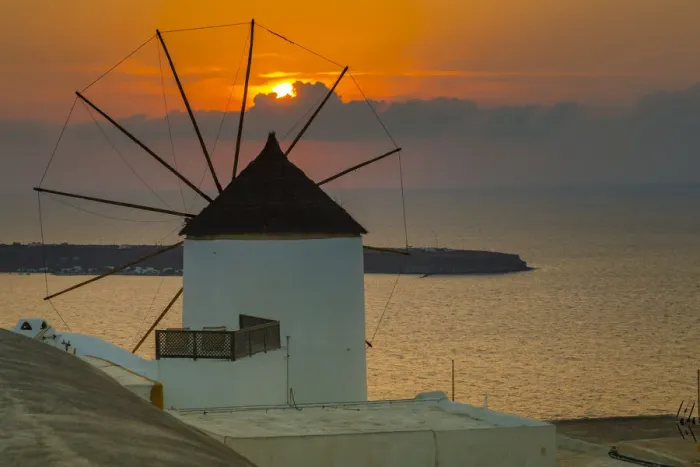 Framed Print : View of windmill at sunset in Oia village, Santorini, Aegean Island, Cyclades Island
