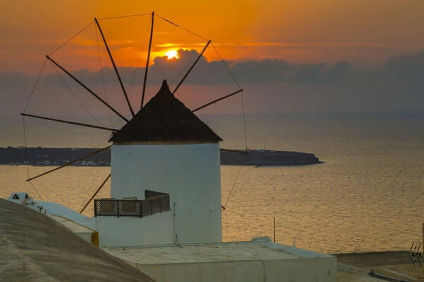 View of windmill at sunset in Oia village, Santorini, Aegean Island, Cyclades Island
