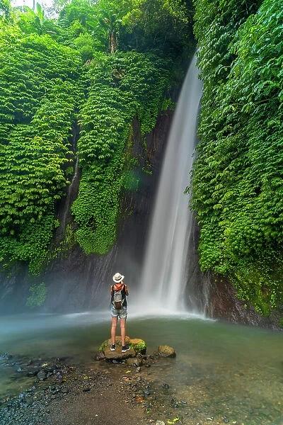 View of woman taking picture at Melanting waterfall, Kabupaten Buleleng, Gobleg, Bali, Indonesia, South East Asia, Asia