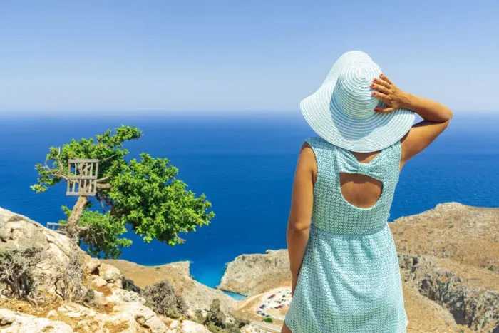 Framed Print : Back view of young woman with dress and sun hat watching the sea, Crete, Greek Islands Framed Print : Back view of young woman with dress and sun hat watching the sea, Crete, Greek Islands