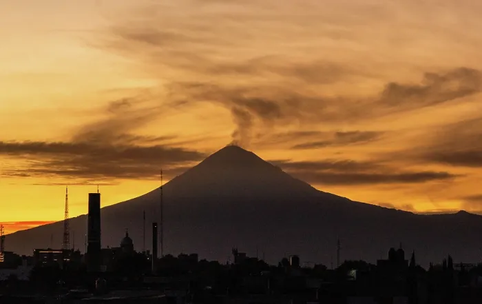 Framed Print : Views of the active Popocateptl volcano, with a plume of smoke from historical old town in Puebla, Mexico Framed Print : Views of the active Popocateptl volcano, with a plume of smoke from historical old town in Puebla, Mexico