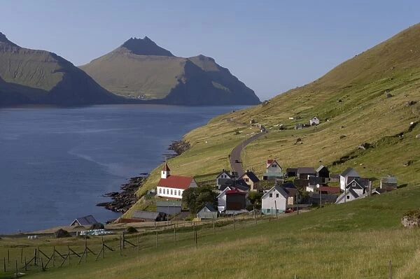 Village of Kunoy, located on the west coast of the island Kunoy, impressively surrounded by high mountains, Kunoy Island, Nordoyar, Faroe Islands (Faroes)
