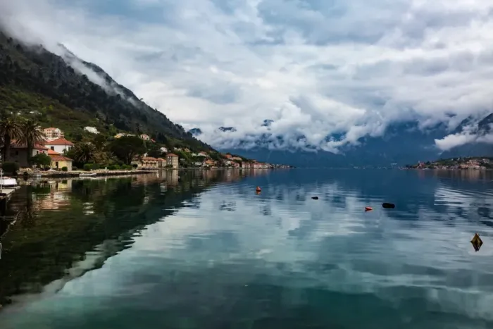 Framed Print : The village of Muo which faces Kotor across the bay, the mountains covered in low cloud Framed Print : The village of Muo which faces Kotor across the bay, the mountains covered in low cloud