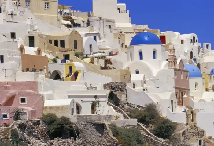 Framed Print : Village of Oia with blue churches and colourful dwellings Framed Print : Village of Oia with blue churches and colourful dwellings