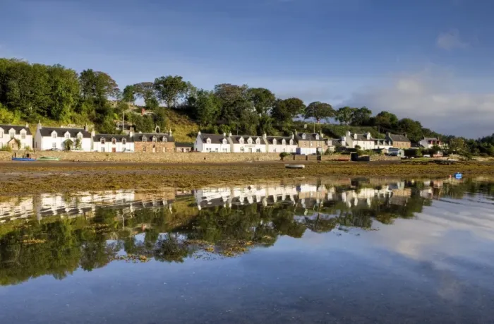 Framed Print : Village of Plockton bathed in early morning light and reflecting in calm sea at low tide Framed Print : Village of Plockton bathed in early morning light and reflecting in calm sea at low tide