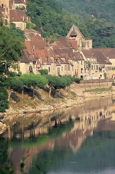 Village reflected in the water of the Dordogne River, La Roque-Gageac, Dordogne