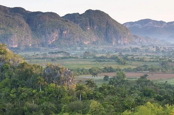 The Vinales Valley, UNESCO World Heritage Site, bathed in early morning sunlight, from Hotel Los Jasmines, Vinales, Pinar Del Rio, Cuba, West Indies, Caribbean, Central America