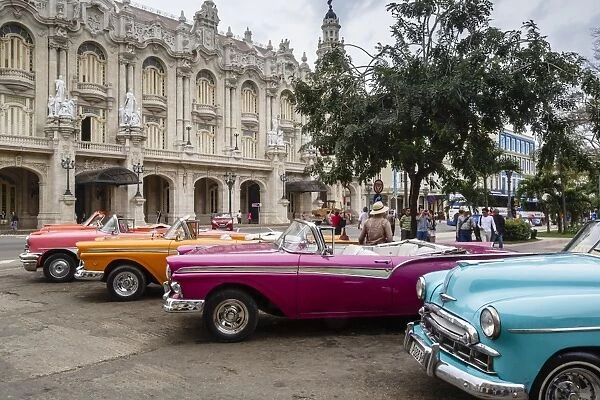 Vintage American cars parking outside the Gran Teatro (Grand Theater), Havana, Cuba