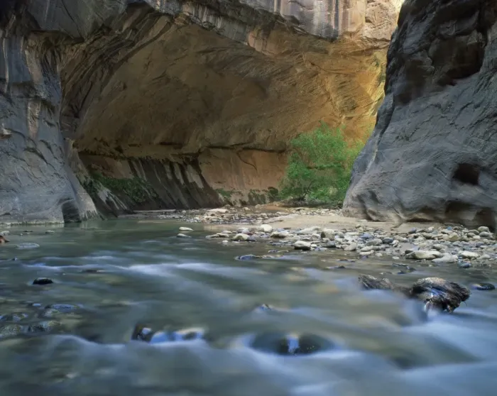 Framed Print : The Virgin River flows beneath overhanging cliff in the Zion National Park in Utah Framed Print : The Virgin River flows beneath overhanging cliff in the Zion National Park in Utah