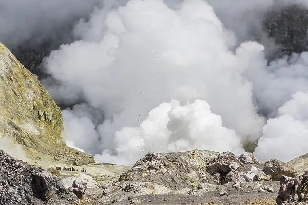 Visitors to an active andesite stratovolcano on White Island, off the East side of North Island, New Zealand, Pacific