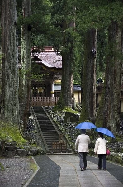 Visitors at Chokushimon Imperial Gate at Eiheiji Temple, headquarters of the Soto sect of Zen Buddhism, in