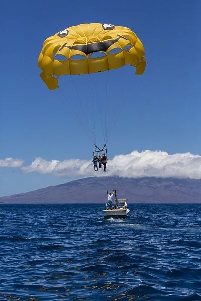 Visitors parasailing in the AuAu Channel, Maui, Hawaii, United States of America, Pacific