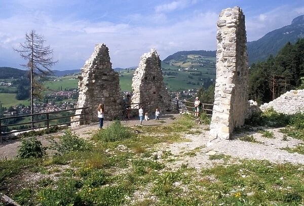 Visitors at Salegg (Salego) ruins and Siusi village