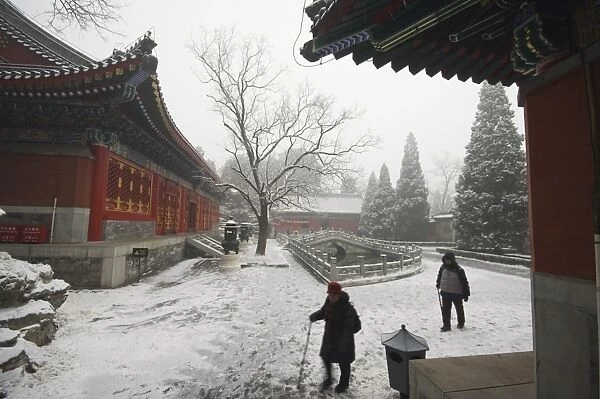 Visitors to a temple after winter snow, Fragrant Hills Park, Western Hills