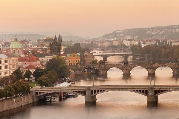 Vltana River with the bridges, Charles Bridge (UNESCO World Heritage Site) and the Old Town Bridge Tower at Sunrise, Prague, Bohemia, Czech Republic