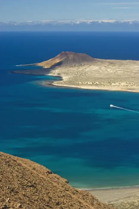 Framed Print : Volcanic cinder cone on Graciosa Island and the Graciosa to Lanzarote ferry in the Rio strait Framed Print : Volcanic cinder cone on Graciosa Island and the Graciosa to Lanzarote ferry in the Rio strait