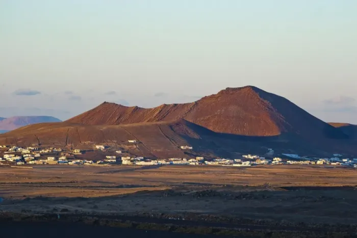 Framed Print : Volcanic cinder cones and the town of Soo at sunset in the mid north of the island