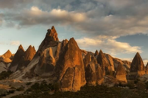 Volcanic desert landscape and its fabulous geographical structures caught in evening light, Goreme, Cappadocia, Anatolia, Turkey, Asia Minor, Eurasia