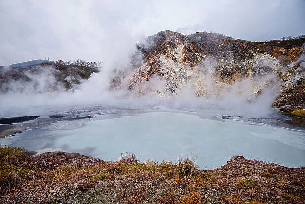 Volcanic field and steaming pond in Noboribetsu, Hell Valley, Hokkaido, Japan, Asia