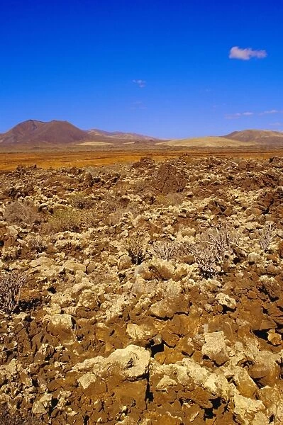 Volcanic landscape with volcanoes in background near Tiscamanita
