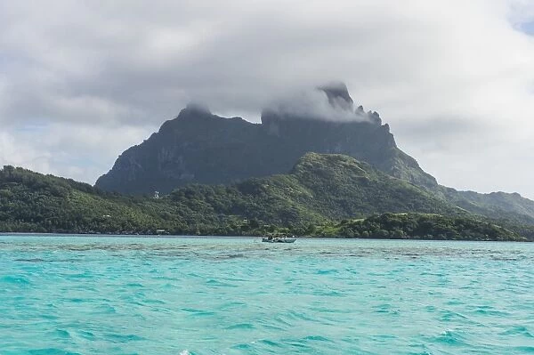 The volcanic rock in the turquoise lagoon of Bora Bora, Society Islands, French Polynesia