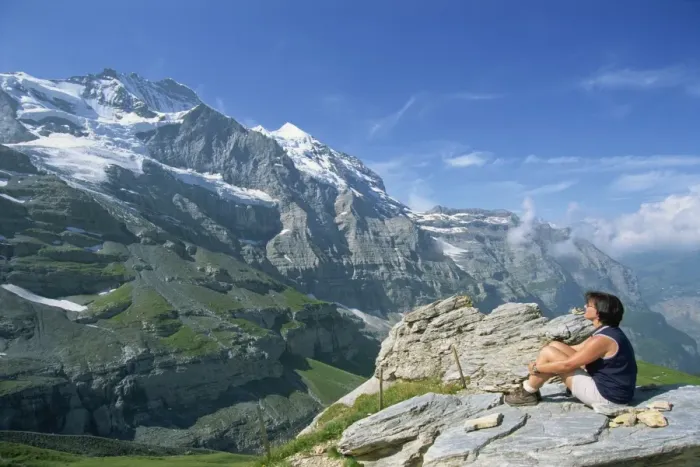 Framed Print : Walker on a rock looking at the Jungfrau peak Framed Print : Walker on a rock looking at the Jungfrau peak