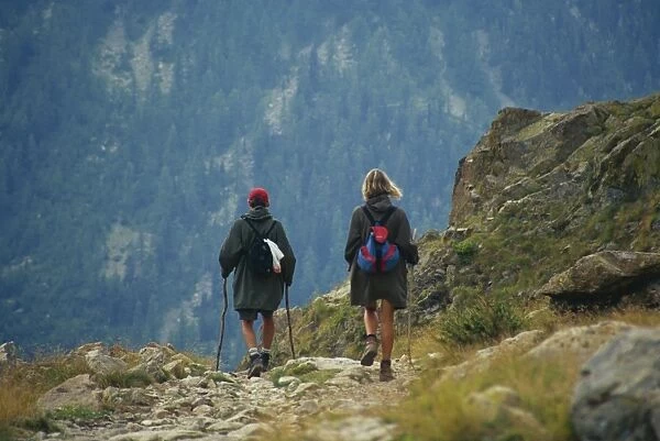 Walkers on path to Lac de Fenestre, Mercantour National Park, Provence, France, Europe